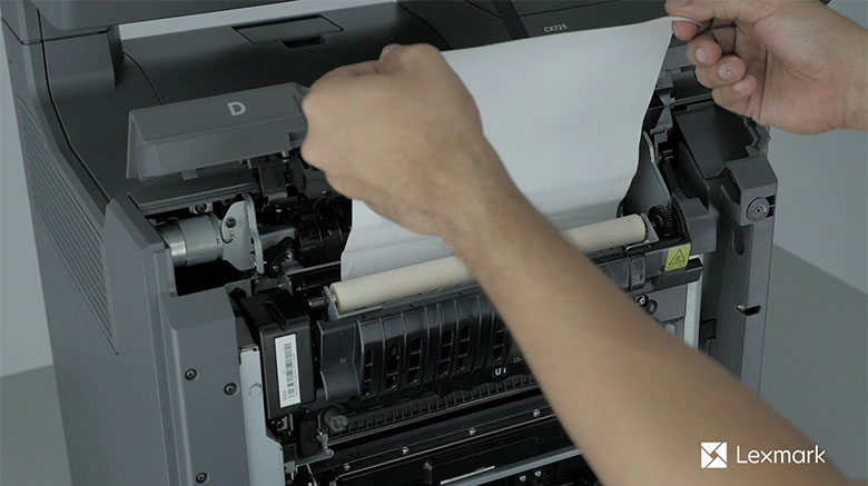 Remove the jammed paper in the fuser access door
