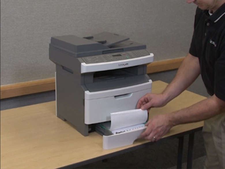 Pull out Tray 1 and remove any creased or wrinkled paper